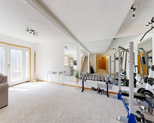 Bright workout area with mirrors