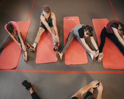 Group of people stretching on mats