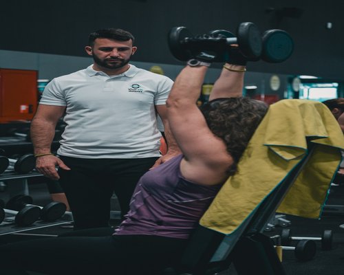 Male trainer organizing class